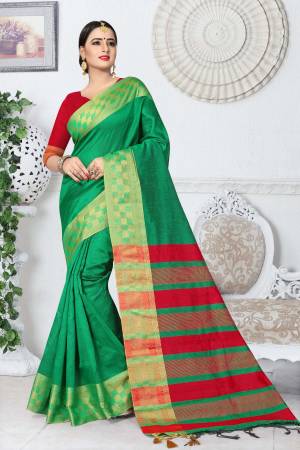 Grab This Saree In Proper Traditonal Look In Green Color Paired With Contrasting Red Colored Blouse. This Saree And Blouse Are Fabricated On Kanjivaram Art Silk. It Is Durable And Easy To Care For.