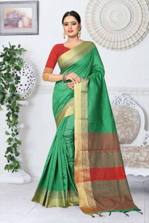 Grab This Saree In Proper Traditonal Look In Sea  Green Color Paired With Contrasting Red Colored Blouse. This Saree And Blouse Are Fabricated On Kanjivaram Art Silk. It Is Durable And Easy To Care For.