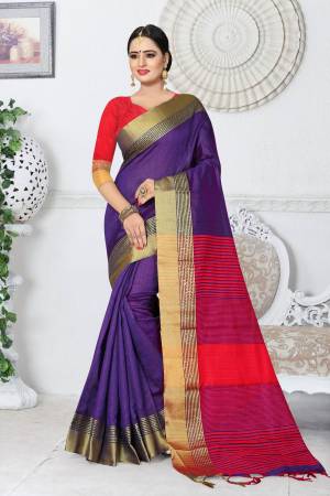 Add This Attractive Colored Saree In Purple Paired With Contrasting Red Colored Blouse. This Saree And Blouse Are Fabricated On Kanjivaram Art Silk. It Is Light Weight And Easy To Drape.