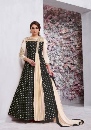 Grab This Beautiful Designer Radymade Suit In Black And Cream Colored Top Paired With Cream Colored Bottom And Dupatta. Its Top Is Fabricated On Art Silk Paired With Santoon Bottom And Chiffon Dupatta. Its Top Is Fully Stitched With Extra Margin And Unstitched Bottom. Buy This Suit Now.