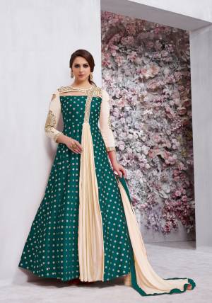 Grab This Beautiful Designer Radymade Suit In Teal Green And Cream Colored Top Paired With Cream Colored Bottom And Dupatta. Its Top Is Fabricated On Art Silk Paired With Santoon Bottom And Chiffon Dupatta. Its Top Is Fully Stitched With Extra Margin And Unstitched Bottom. Buy This Suit Now.