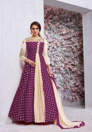 Grab This Beautiful Designer Radymade Suit In Purple And Cream Colored Top Paired With Cream Colored Bottom And Dupatta. Its Top Is Fabricated On Art Silk Paired With Santoon Bottom And Chiffon Dupatta. Its Top Is Fully Stitched With Extra Margin And Unstitched Bottom. Buy This Suit Now.