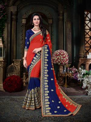 Grab This Beautiful Designer Saree In Red And Royal Blue Color Paired With Royal Blue Colored Blouse. This Saree Is Fabricated On Georgette Paired With Art Silk Fabricated Blouse. This Saree Is Beautified With Jari Embroidery All Over. Buy Now.