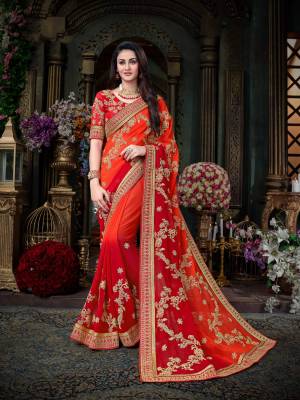 Orange And Red Color Induces Perfect Summery Appeal To Any Outfit, So Grab This Designer Saree In Shades Of Orange And Red Color Paired With Red Colored Blouse. This Saree Is Fabricated On Georgette Paired With Art Silk Fabricated Blouse. It Has Heavy Coding Work All Over The Saree. Buy Now.