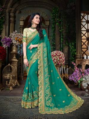 Celebrate This Festive Season Wearing This Saree In Green Color Paired With Golden Colored Blouse. This Saree Is Fabricated On Georgette Paired With Gota Fabricated Blouse. Buy This Pretty Designer Saree Now.