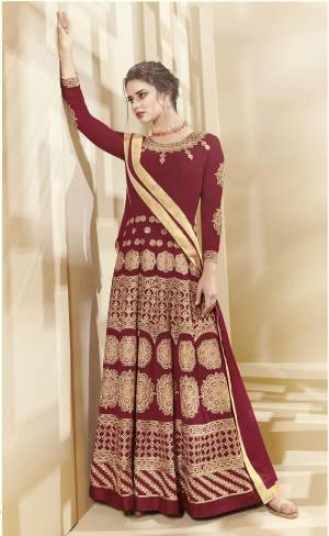 For A Rich And Royal Look, Grab This Beautiful Designer Floor Length Suit In Maroon Color Paired With Maroon Colored Bottom And Dupatta. Its Top Is Fabricated On Georgette Paired With Santoon Bottom And Chiffon Dupatta. This Suit Has Heavy Jari Embroidery All Over It. Buy Now.