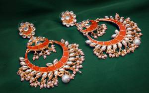 Grab This Beautiful Traditonal Heavy Earrings In Golden and Orange Color Beautified With Stone And Moti Work. These Pair Of Beautiful Earrings Can Be Paired With Orange Or Any Contrasting Colored Ethnic Attire.