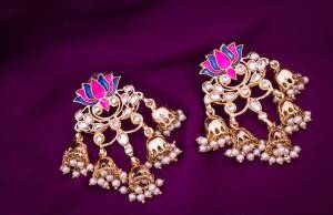 Here Is Another Attractive Pair Of Earrings In Golden and Pink Color Beautified With Stone And Moti Work. This Lovely Earrings Set Is Light In Weight And Easy To Carry Throughout The Gala.