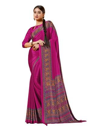 Shine Bright Wearing This Saree In Rani Pink Color Paired With Rani Pink Colored Blouse. This Saree And Blouse are Fabricated On Crepe Beautified With Prints All Over. Buy This Saree Now.