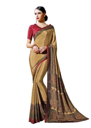 You Must Have Some Casuals To Your Wardrobe, Grab This Pretty Saree In Beige And Yellow Color Paired With Contrasting Red Colored Blouse. This Saree And Blouse are Fabricated On Crepe Beautified With Prints all Over.