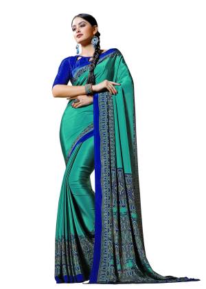 Look Attractive Wearing This Lovely Saree In sea Green Color Paired With Contrasting Royal Blue Colored Blouse. This Saree And Blouse Are Fabricated On Crepe Beautified With Prints All Over It. Buy This Elegant Saree Now.