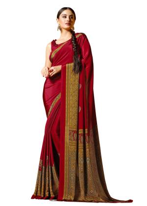 Adorn The Pretty Angelic Look, Wearing This Saree In Red Color Paired With Red Colored Blouse. This Saree and Blouse Are Fabricated On Crepe Beautified With Prints all Over It.