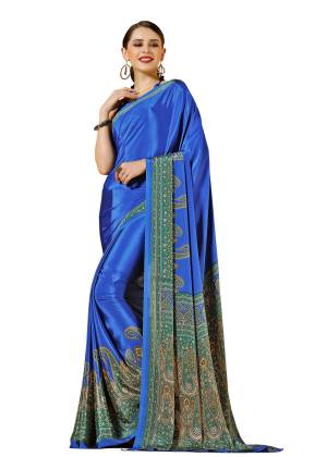 Here Is Cool Colored Saree In Blue Paired With Blue Colored Blouse. This Saree And Blouse Are Fabricated On Crepe Beautified With Paisly Prints All Over. 