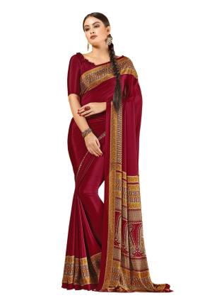 For A Royal Look, Grab This Pretty Saree In Maroon Color Paired With Maroon Colored Blouse. This Saree And Blouse Are Fabricated On Crepe Beautified With Prints all Over It.