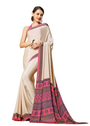 You Will Definitely Earn Lots Of Compliments Wearing This Saree In Cream Color Paired With Contrasting Light Pink Colored Blouse. This Saree And Blouse Are Fabricated On Crepe Beautified With Prints Over The Pallu.