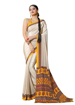 Flaunt Your Rich And Elegant Taste Wearing this Saree In Cream Color Paired With Yellow Colored Blouse. This Saree And Blouse Are Fabricated On Crepe Beautified With Prints All Over Pallu. Buy This Lovely Saree Now.
