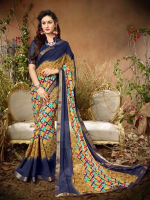 Go Colorful Wearing This Pretty Saree In Multi Color Paired With Navy Blue Colored Blouse. This Saree And Blouse Are Fabricated On Georgette Beautified With Prints All Over It. Buy This Saree Now.