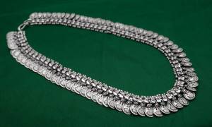 For The Upcoming Festivals, Grab This Beautiful Necklace In Silver Color With Coins Pattern All Over. This Necklace Set Is Light In Weight And Easy To Carry All Day Long.