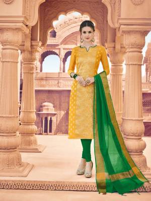 Celebrate This Festive Season with Beauty And Comfort Wearing This Suit In Yellow Colored Top Paired With Contrasting Green Colored Bottom And Dupatta. This Dress Material Is Fabricated On Banarasi Art Silk Paired With Cotton Bottom And Khadi Silk Dupatta. Buy This Dress Material Now.