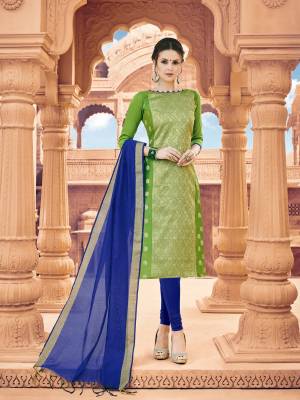 Look Beautiful In This Straight Suit In Green Colored Top Paired With Contrasting Royal Blue Colored Bottom And Dupatta. Its Top Is Fabricated On Banarasi Art Silk Paired With Cotton Bottom And Khadi Silk Dupatta. Buy This Suit Now.
