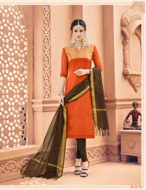 Shine Bright In This Rich And Unique Combination Straight Cut Suit In Orange Colored Top Paired With Contrasting Brown Colored Bottom And Dupatta. Its Top Is Fabricated On Banarasi Art Silk Paired With Cotton Bottom And Khadi Silk Dupatta. Buy It Now.