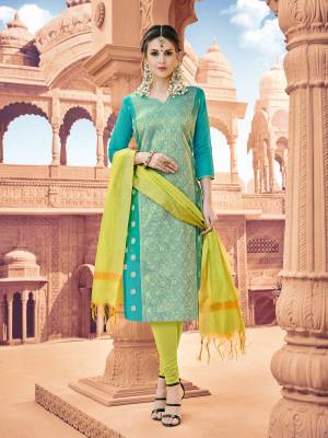 Add This Pretty Dress Material To Your Wardrobe And Get This Stitched As Per Your Desired Fit And Comfort. Its Top Is In Turquoise Blue Colored Top Paired With Contrasting Pear Green Colored Bottom And Dupatta. Its Top Is fabricated On Banarasi Art Silk Paired With Cotton Bottom And Khadi Silk Dupatta.