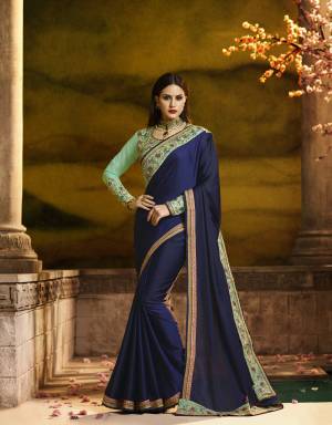 Enhance Your Personality Wearing Designer Saree In Navy Blue Color Paired With Contrasting Sea Green Colored Blouse. This Saree Is Fabricated On Silk Georgette Paired With Art Silk And Georgette Fabricated Blouse. This Saree And Blouse Are Beautified With Heavy embroidery. 