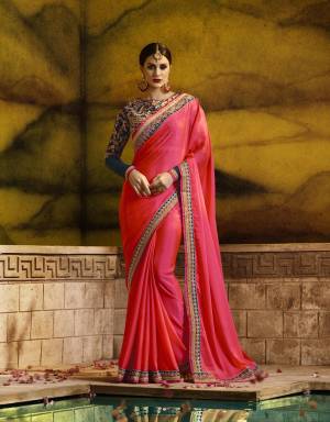 Shine Bright In This Attractive Colored Saree In Fuschia Pink Color Paired With Contrasting Navy Blue Colored Blouse. This Saree Is Fabricated On Silk Georgette Paired With Art Silk And Georgette Fabricated Blouse. It Is Beautified With Resham And Jari Embroidery All Over. Buy This Designer Saree Now.