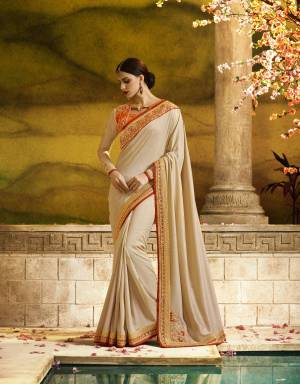 Simple And Elegant Looking Saree Is Here In Off-White Color Paired With Orange Colored Blouse. This Saree Is Fabricated On Silk Georgette Paired With Art Silk And Georgette Fabricated Blouse. This Designer Saree Will Earn You Lots Of Compliments From Onlookers. 