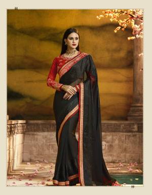 For A Bold and Beautiful Look, Grab This Designer Saree In Black Color Paired With Red Colored Blouse. This Saree Is Fabricated On Georgette Paired With Art Silk And Georegtte Fabricated Blouse. This Saree IS Light In Weight And Easy To carry Throughout The Gala.