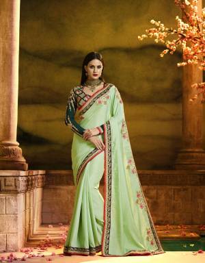 This Season Is About Subtle Shades And Pastel Play, Grab This Beautiful Designer Saree In Pastel Green Color Paired With Pine Green Colored Blouse. This Saree Is Fabricated On Silk Georgette Paired With Art Silk And Georgette Fabricated Blouse. Its Lovely Combination In Saree, Blouse And Embroidery Is A Perfect Match In Designing. Buy This Saree Now.
