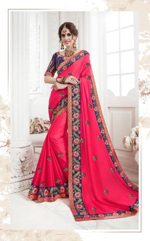 Shine Bright Wearing This Designer Bright Colored Saree In Fuschia Pink Color Paired With Contrasting Navy Blue Colored Blouse. This Saree Is Fabricated On Georgette Paired With Art Silk Fabricated Blouse. It Is Beautified With Multi Colored Embroidery All Over. 