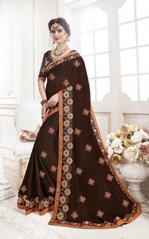 Enhance Your Personality Wearing This Designer Saree In Brown Color Paired With Brown Colored Blouse. This Saree Is Fabricated On Georgette Paired With Art Silk Fabricated Blouse. It Pretty Detailed Embroidery All Over.