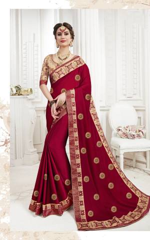 For A Royal Look, Grab This Beautiful Designer Saree In Maroon Color Paired With Beige Colored Blouse. This Saree Is Fabricated On Georgette Paired With Art Silk Fabricated Blouse. Buy This Saree Now.