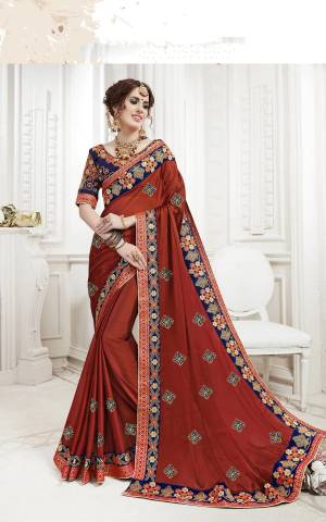 New And Unique Shade Is Here With This Designer Saree In Rust Orange Color Paired With Contrasting Royal Blue Colored Blouse. This Saree Is Fabricated On Georgette Paired With Art Silk Fabricated Blouse. 