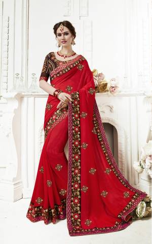 Adorn the Pretty Angelic Look Wearing This Saree In Red Color Paired With Contrasting Brown Colored Blouse. This Saree Is Fabricated On Georgette Paired With Art Silk Fabricated Blouse. It Is Light Weight And Easy To Carry all Day Long.
