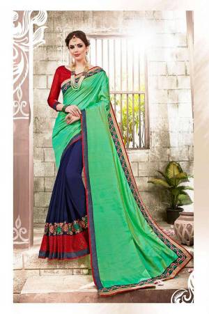 Grab This Colorrful Saree In Green And Navy Blue Color Paired With Contrasting Red Colored Blouse. This Saree Is Fabricated On Satin And Georgette Paired With Art Silk Fabricated Blouse. This Colorful Saree Will Give An Attractive Look Amongst All.