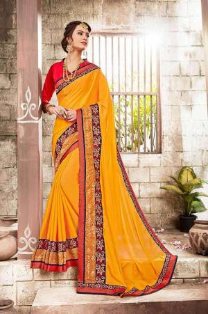 Yellow And Red Color Induces Perfect Summery Appeal To Any Outfit, So Grab This Saree In Yellow Color Paired With Contrasting Red Colored Blouse. This Saree Is Fabricated On Georgette Paired With Art Silk Fabricated Blouse. Buy This Saree Now.