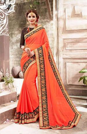 Shine Bright Wearing This Saree In Orange Color Paired With Contrasting Brown Colored Blouse. This Saree Is Fabricated On Chiffon Paired With Art Silk Fabricated Blouse. Buy This Saree Now.