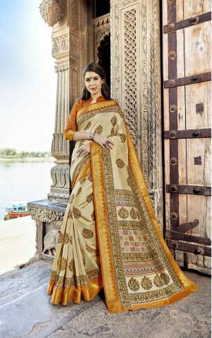 For A Formal Function Or Get Togather, Grab This Rich And Elegant Looking Saree In Cream Color Paired With Musturd Yellow Colored Blouse. This Saree And Blouse Are Fabricated On Cotton Silk Beautified With Prints All Over It. 