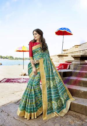 Very Pretty Shade In Green Is Here With This Saree In Sea Green Color Paired With Contrasting Red Colored Blouse. This Saree And Blouse Are Fabricated On Cotton Silk Beautified With Small Prints All Over It. Buy This Saree Now.
