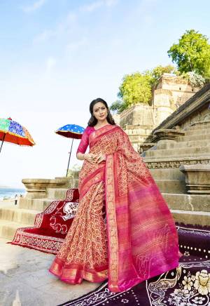 Add This Pretty Saree To Your Wardrobe In Pink And Cream Color Paired With Pink Colored Blouse. This Saree And Blouse Are Fabricated On Cotton Silk Beautified With Prints. Buy This Pretty Saree Now.