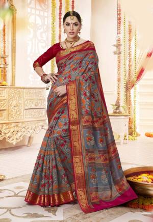 You Will Definitely Earn Lots Of Compliments Wearing this Saree In Blue And Red Color Paired With Red Colored Blouse. This Saree And Blouse Are Fabricated On Cotton Silk Beautified With Contrasting Colored Floral Prints. Buy This Saree Now.