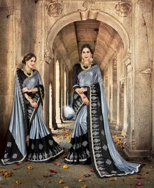 For A Bold And Beautiful Look, Grab This Designer Saree In Grey And Black Color Paired With Black Colored Blouse. This Saree Is Fabricated On Lycra And Georgette Paired With Art Silk Fabricated Blouse. It Is Beautified With Attractive Resham Embroidery. Buy This Saree Now.