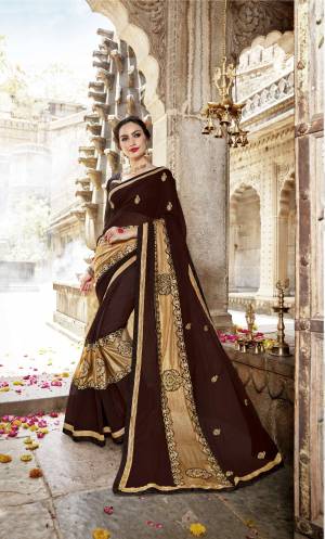 Enhance Your Personality Wearing This Saree In Brown Color Paired With Brown Colored Blouse. This Saree Is Fabricated On Lycra And Georgette Paired With Art Silk Fabricated Blouse. This Pretty Saree Is Light Weight And Easy To Carry All Day Long.