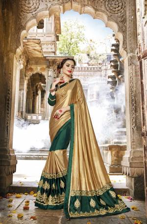Catch All The Limelight At The Next Party You Attend Wearing This Designer Saree In Golden And Teal Green Color Paired With Teal Green Colored Blouse, This Saree Is Fabricated On Lycra And Georgette Paired With Art Silk Fabricated Blouse. Buy This Designer Saree Now.