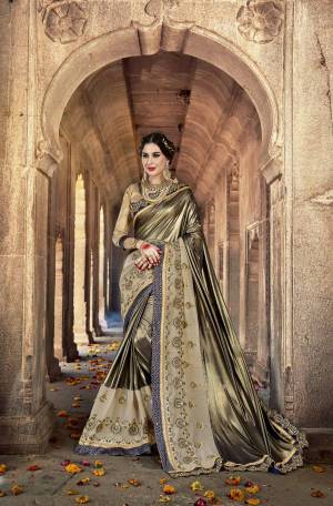 Appealing Saree Is Here Which Gives An Attractive Look To Your Personality. Grab This Designer Saree In Copper And Grey Color Paired With Golden Colored Blouse. This Saree Is Fabricated On Lycra And Georgette Paired With Art Silk Fabricated Blouse. This Saree Now.