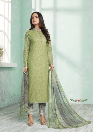 For A Rich And Elegant Beauty, Grab This Designer Straight Suit In Light Green Colored Top Paired With Contrasting Grey Colored Bottom And Dupatta. Its Top And Bottom Are Fabricated On Cotton Paired With Chiffon Dupatta. It Has Lovely Prints All Over With Embroidery Over The Slevees. Buy Now.
