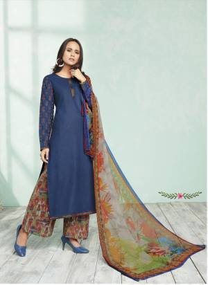 Get This Lovely Suit Tailored As Per Your Desired Fit And Comfort. Its Top Is In Blue Color Paired With Multi Colored Printed Bottom And Dupatta. Its Top And Bottom Are Fabricated On Cotton Paired With Chiffon Dupatta. Buy This Suit Now.