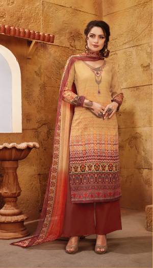 Another Shaded Suit Is Here In Beige And Maroon Color Paired With Maroon Colored Bottom And Multi Colored Dupatta. Its Top And Bottom Are Fabricated On Satin Paired With Chiffon Dupata. It Is Beautified With Prints And Embroidery. Buy Now.